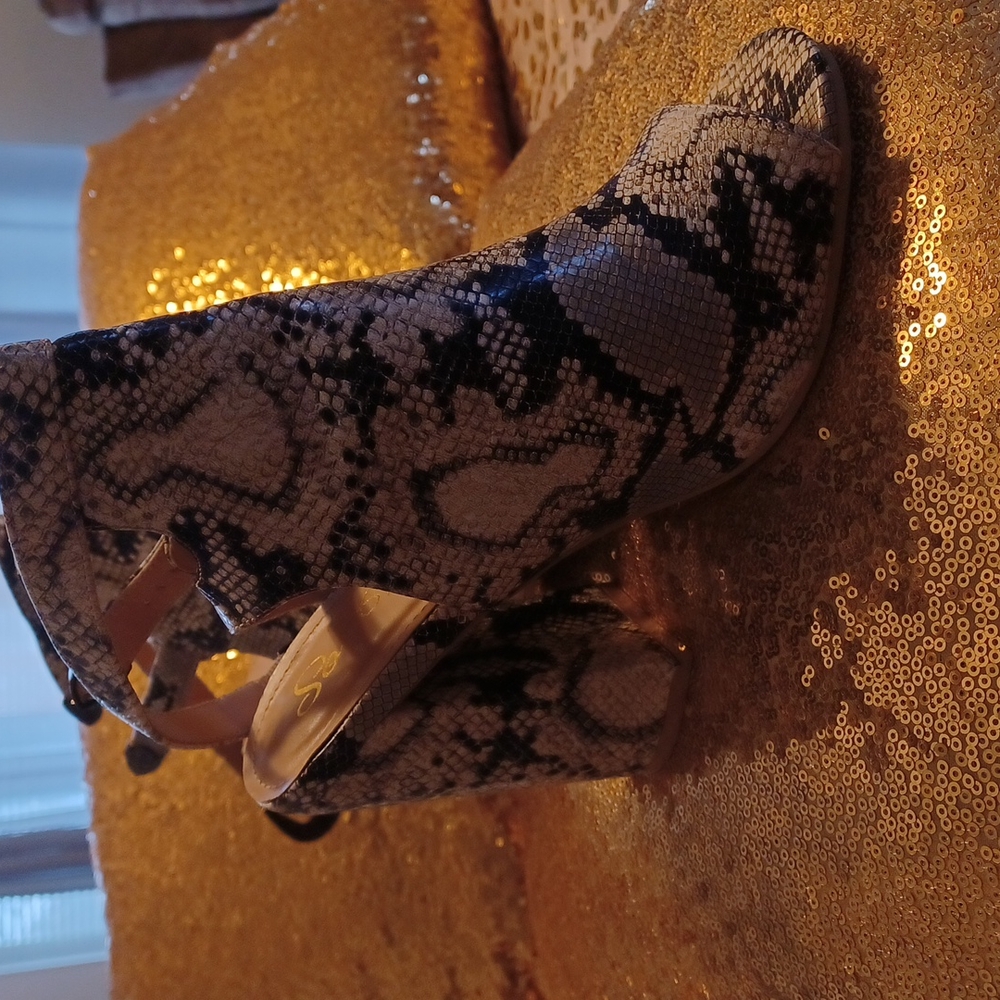 Cream and black snake pattern shoes